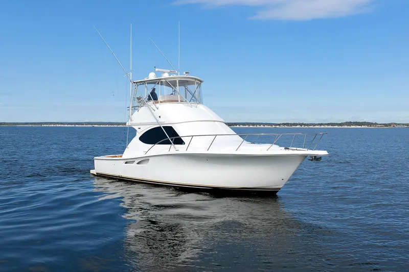 Chasing Tail Yacht Photos Pics 2007 Tiara Yachts 3900 Convertible on open water, clear sky background.