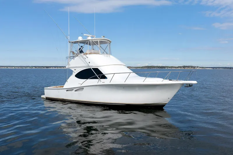 Chasing Tail Yacht Photos Pics 2007 Tiara Yachts 3900 Convertible on calm water under blue sky.