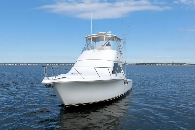 Chasing Tail Yacht Photos Pics 2007 Tiara Yachts 3900 Convertible on open water under blue sky.