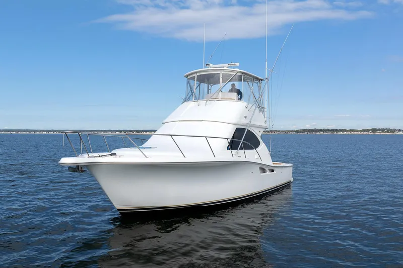 Chasing Tail Yacht Photos Pics 2007 Tiara Yachts 3900 Convertible on open water under clear sky.