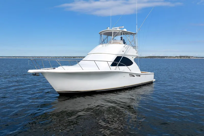 Chasing Tail Yacht Photos Pics 2007 Tiara Yachts 3900 Convertible on open water under clear blue sky.