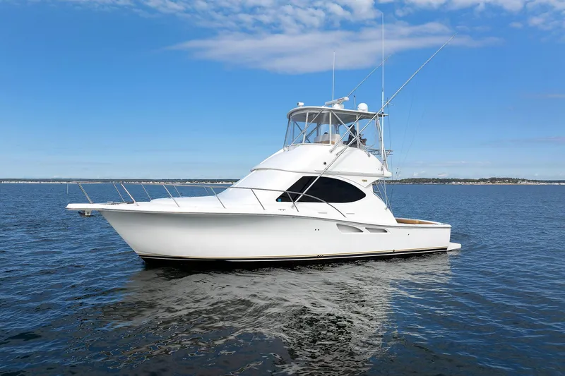 Chasing Tail Yacht Photos Pics 2007 Tiara Yachts 3900 Convertible on calm water under blue sky.