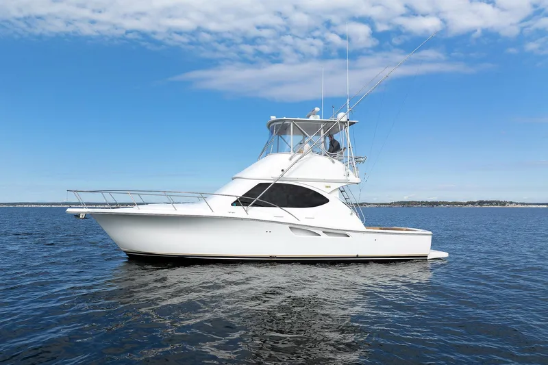 Chasing Tail Yacht Photos Pics 2007 Tiara Yachts 3900 Convertible on open water under blue sky.
