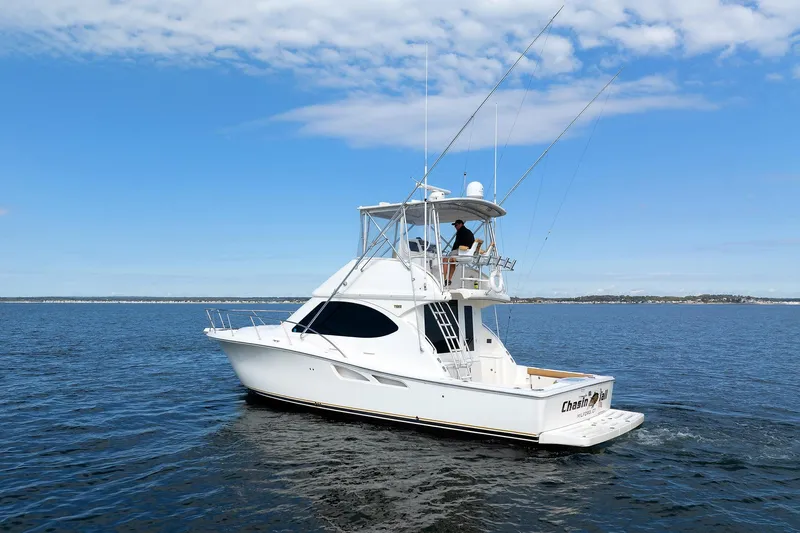 Chasing Tail Yacht Photos Pics 2007 Tiara Yachts 3900 Convertible cruising on open water under blue sky.