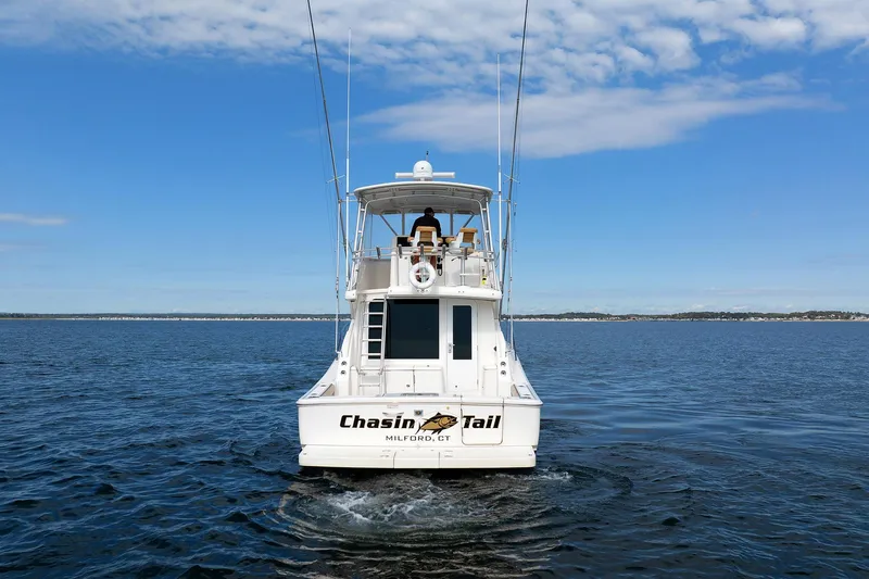 Chasing Tail Yacht Photos Pics 2007 Tiara Yachts 3900 Convertible on open water, rear view.