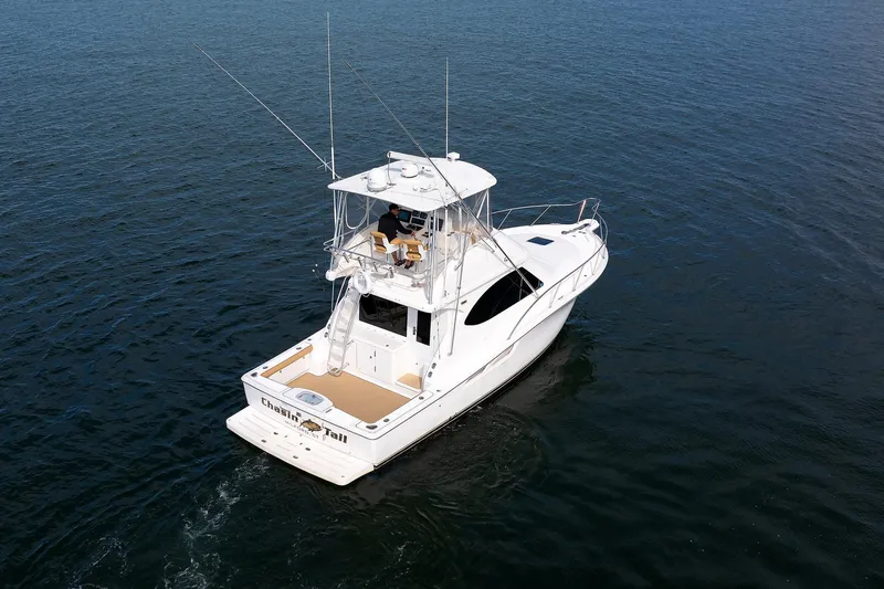 Chasing Tail Yacht Photos Pics 2007 Tiara Yachts 3900 Convertible cruising on open water.