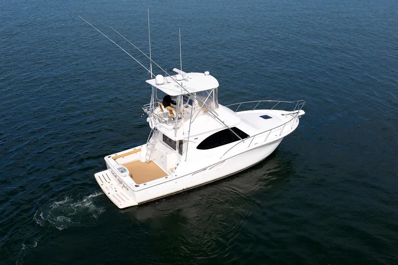 Chasing Tail Yacht Photos Pics 2007 Tiara Yachts 3900 Convertible cruising on open water.