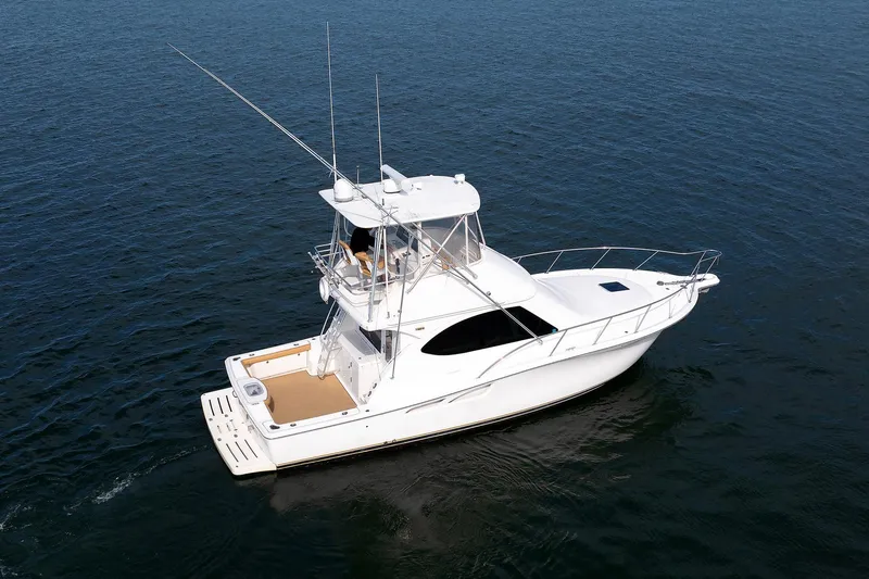 Chasing Tail Yacht Photos Pics 2007 Tiara Yachts 3900 Convertible boat on open water, aerial view.