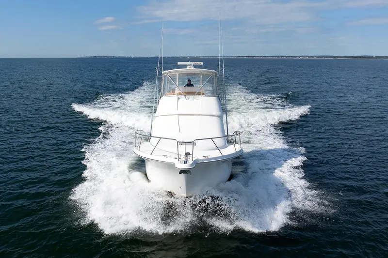 Chasing Tail Yacht Photos Pics 2007 Tiara Yachts 3900 Convertible cruising on open water.