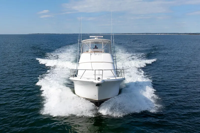 Chasing Tail Yacht Photos Pics 2007 Tiara Yachts 3900 Convertible cruising on open water.