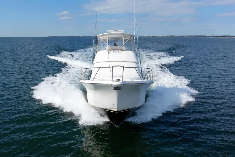 Chasing Tail Yacht Photos Pics 2007 Tiara Yachts 3900 Convertible cruising on open water.