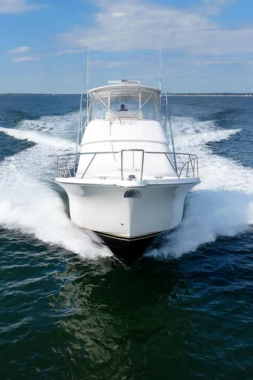 Chasing Tail Yacht Photos Pics 2007 Tiara Yachts 3900 Convertible cruising on open water.