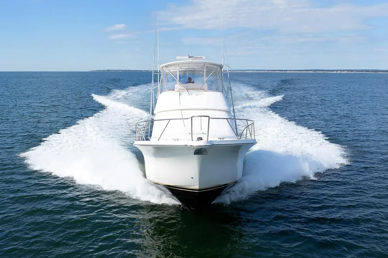 Chasing Tail Yacht Photos Pics 2007 Tiara Yachts 3900 Convertible cruising on open water.