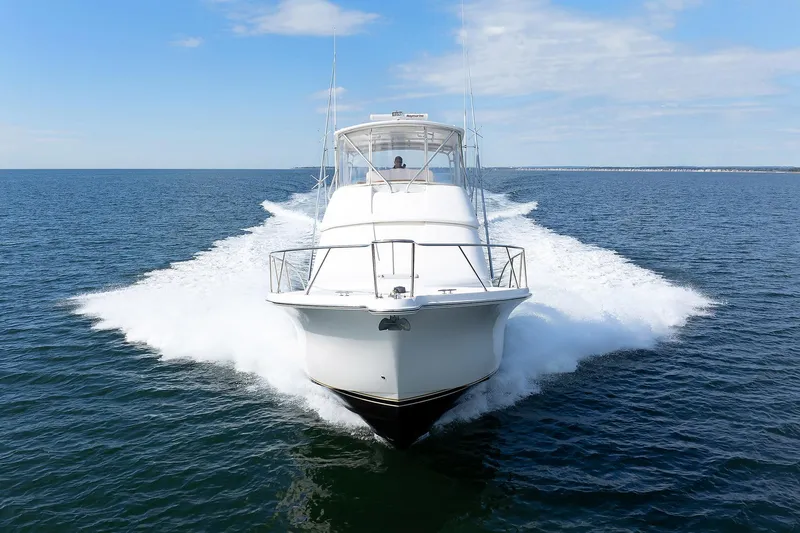 Chasing Tail Yacht Photos Pics 2007 Tiara Yachts 3900 Convertible cruising on open water.