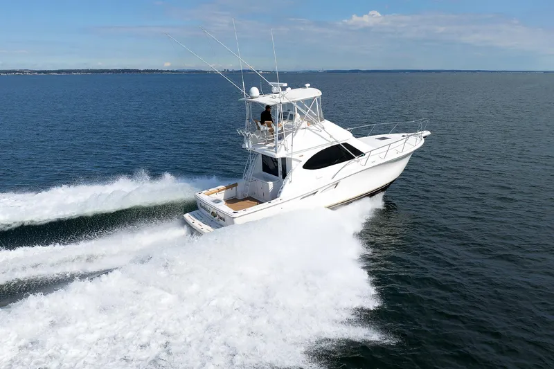 Chasing Tail Yacht Photos Pics 2007 Tiara Yachts 3900 Convertible cruising on open water.