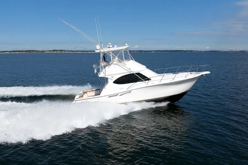 Chasing Tail Yacht Photos Pics 2007 Tiara Yachts 3900 Convertible cruising on open water.