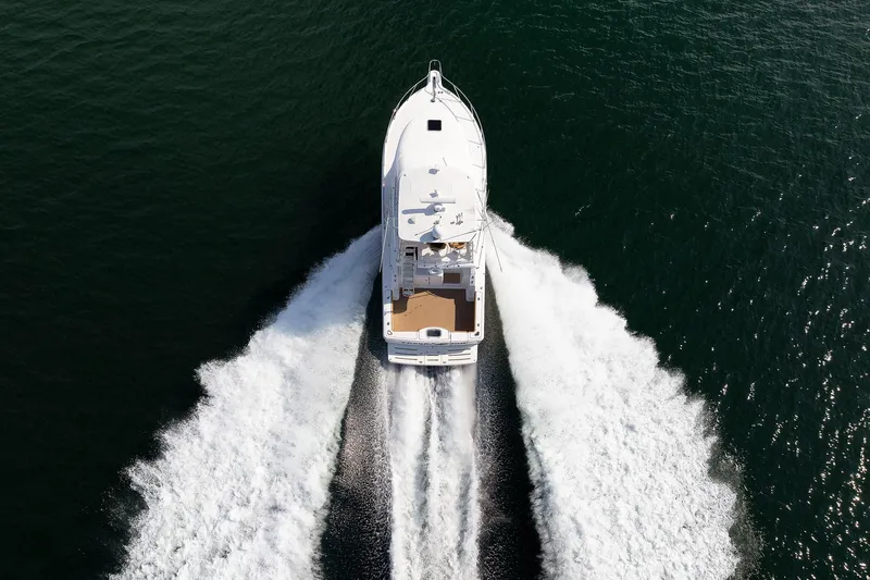 Chasing Tail Yacht Photos Pics Aerial view of 2007 Tiara Yachts 3900 Convertible cruising on open water.