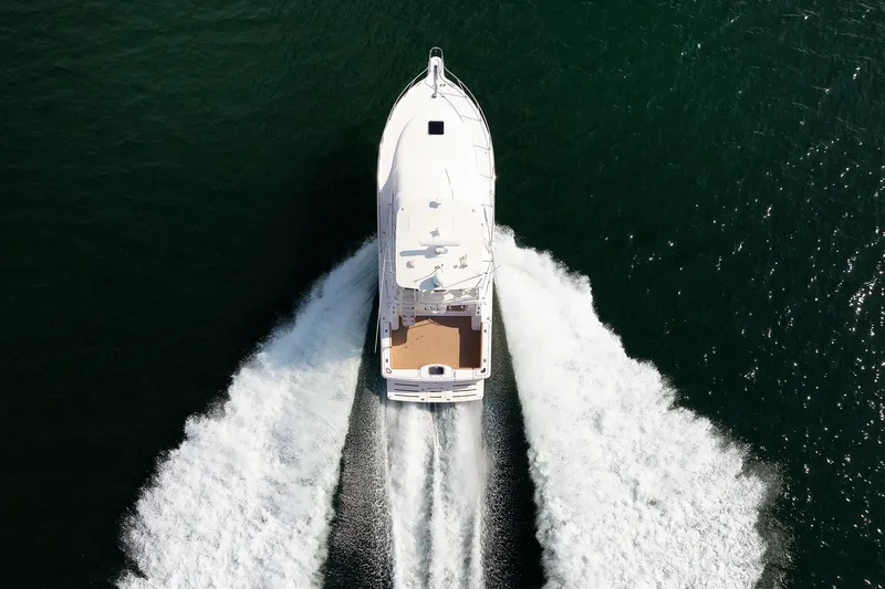 Chasing Tail Yacht Photos Pics Aerial view of 2007 Tiara Yachts 3900 Convertible cruising on open water.