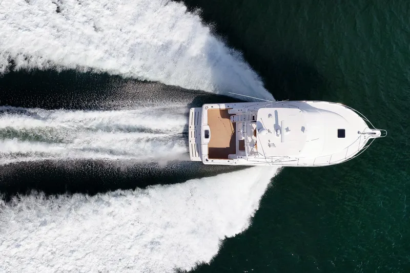 Chasing Tail Yacht Photos Pics Aerial view of 2007 Tiara Yachts 3900 Convertible speeding on water.