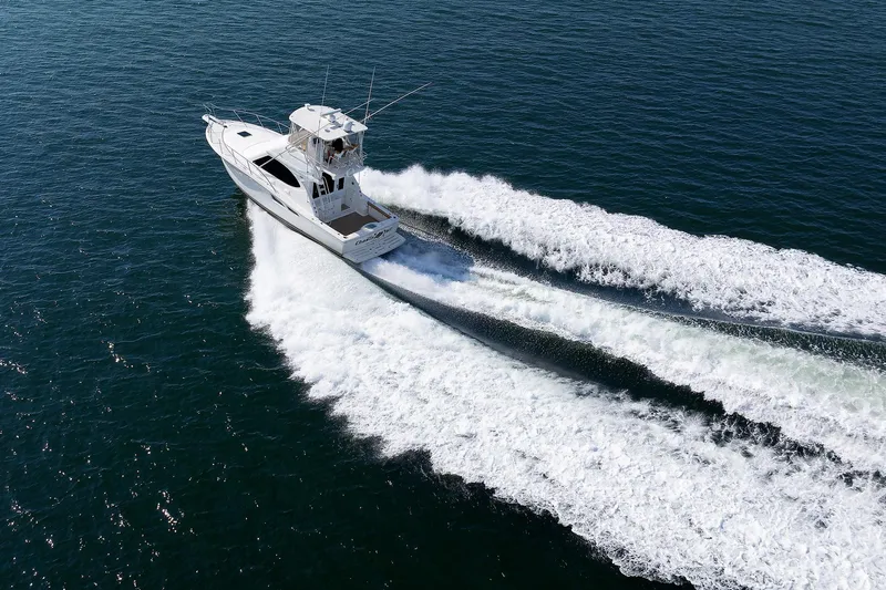 Chasing Tail Yacht Photos Pics 2007 Tiara Yachts 3900 Convertible cruising on open water.