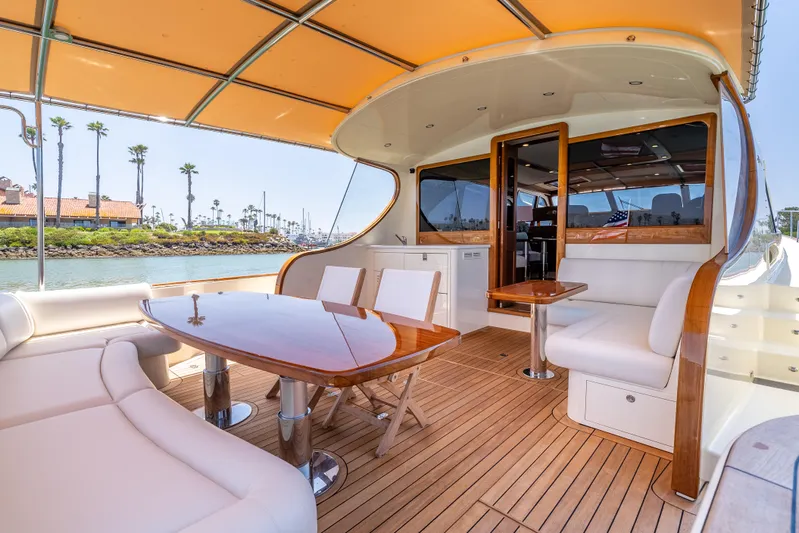 Margin Yacht Photos Pics Luxurious 2025 Palm Beach Motor Yachts PB70 with elegant teak deck and spacious seating area.