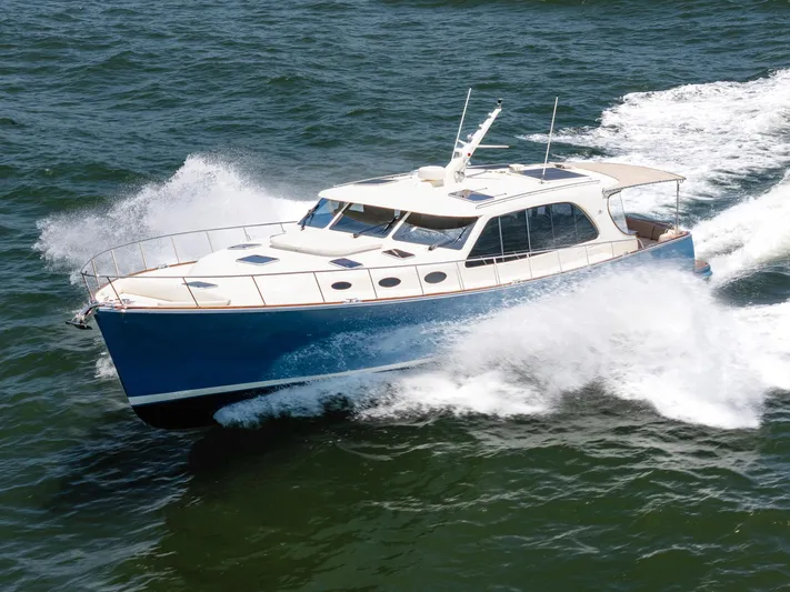 Margin Yacht Photos Pics 2025 Palm Beach Motor Yachts PB70 cruising on open water, showcasing sleek design and performance.