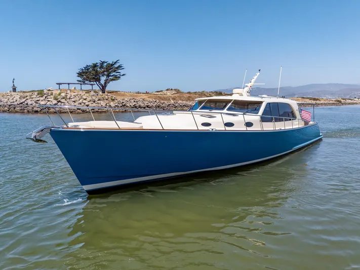 Margin Yacht Photos Pics 2025 Palm Beach Motor Yachts PB70 cruising in a scenic coastal setting.