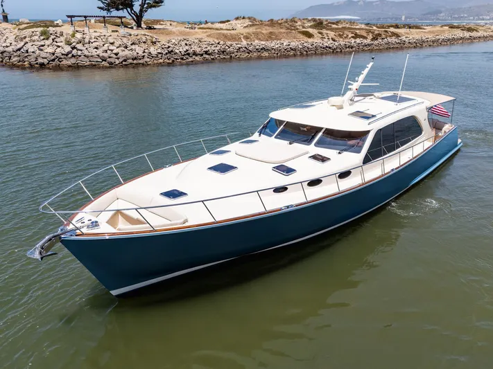 Margin Yacht Photos Pics 2025 Palm Beach Motor Yachts PB70 cruising in a scenic waterway.