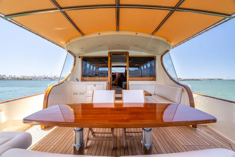 Margin Yacht Photos Pics Luxurious 2025 Palm Beach Motor Yachts PB70 with elegant teak deck and spacious seating area.