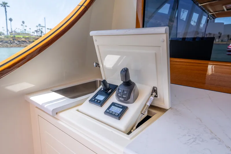 Margin Yacht Photos Pics 2025 Palm Beach Motor Yachts PB70 control panel with joystick and digital display.