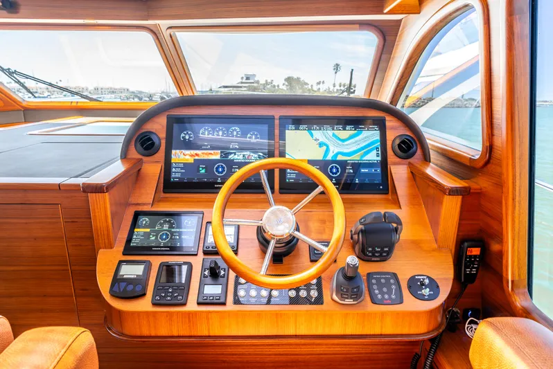 Margin Yacht Photos Pics Helm of 2025 Palm Beach Motor Yachts PB70 with advanced navigation displays and controls.
