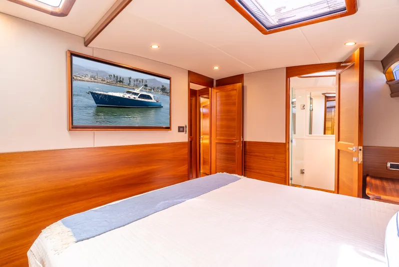 Margin Yacht Photos Pics Luxurious 2025 Palm Beach Motor Yachts PB70 cabin with elegant wood finishes and modern decor.