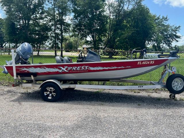 2017 Express XP7 boat on trailer with outboard motor, red and white color scheme.