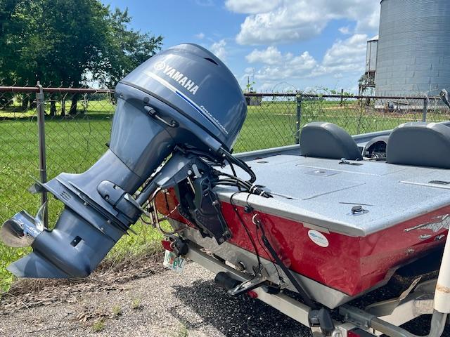 2017 Express XP7 boat with Yamaha outboard motor in a rural setting.