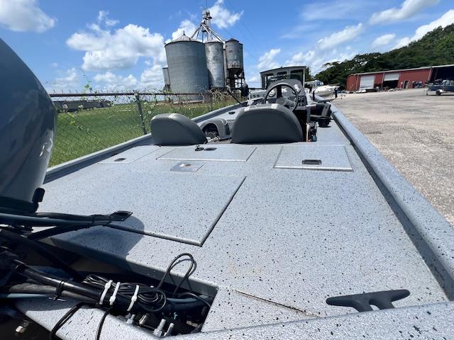 2017 Express XP7 boat with industrial background and clear blue sky.