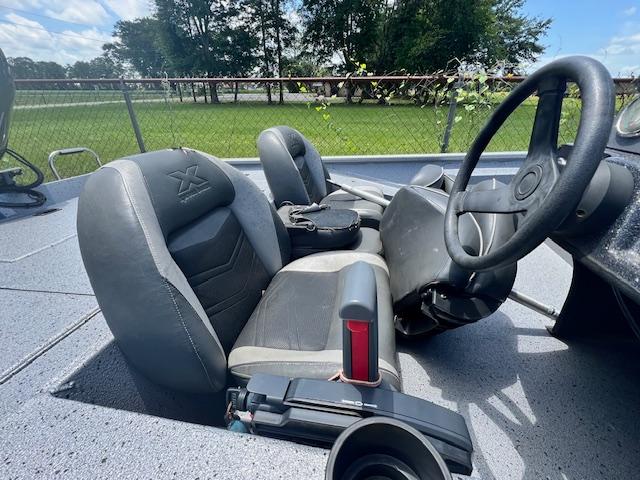 2017 Express XP7 boat interior with steering wheel and seats.