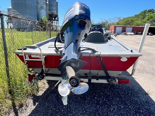 2017 Express XP7 boat with Yamaha outboard motor, rear view.
