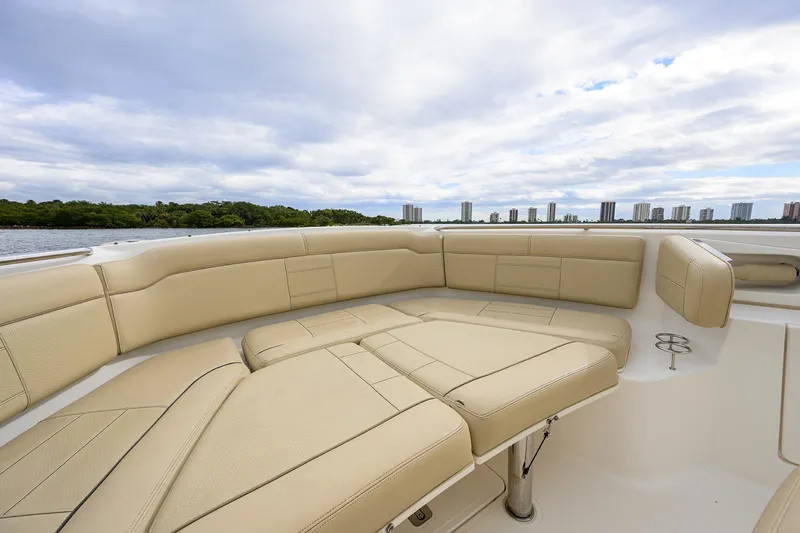  Yacht Photos Pics Luxurious seating on 2019 Pursuit S 328 Sport boat with city skyline view.