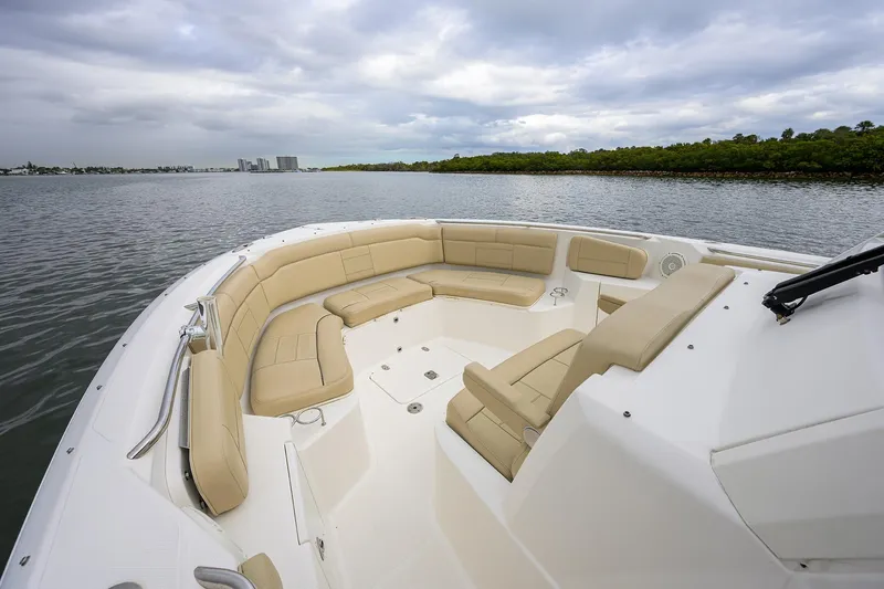  Yacht Photos Pics 2019 Pursuit S 328 Sport boat with spacious seating on calm water.