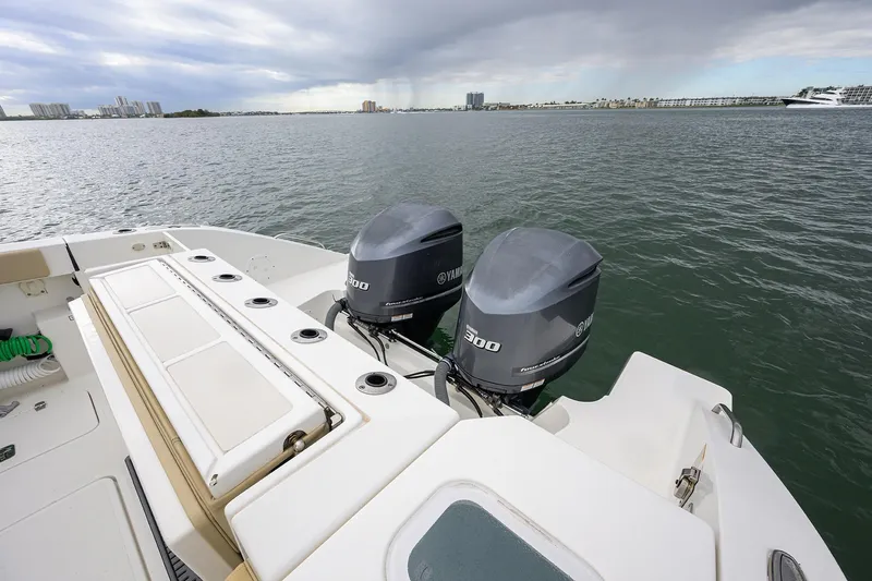  Yacht Photos Pics 2019 Pursuit S 328 Sport boat with twin Yamaha 300 engines on open water.