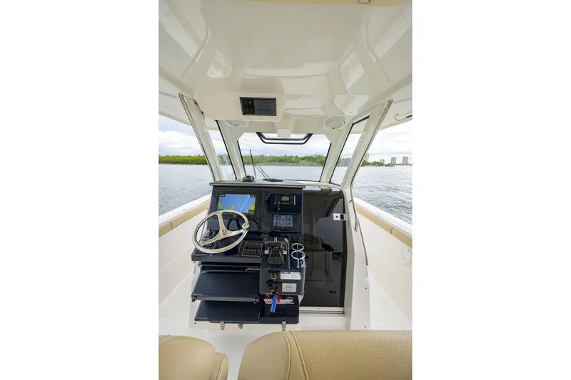  Yacht Photos Pics 2019 Pursuit S 328 Sport boat cockpit with modern navigation system.