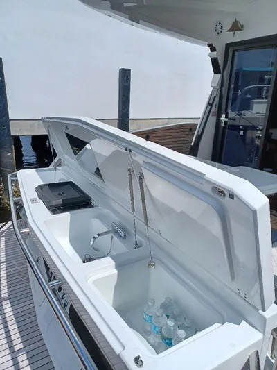 Must Sell, Make An Offer Yacht Photos Pics 2022 Galeon 410 HTC yacht with open deck storage and refreshments.