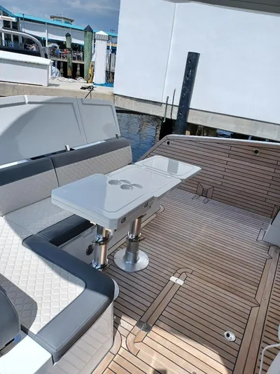 Must Sell, Make An Offer Yacht Photos Pics Luxury seating area on 2022 Galeon 410 HTC yacht with elegant wooden deck.