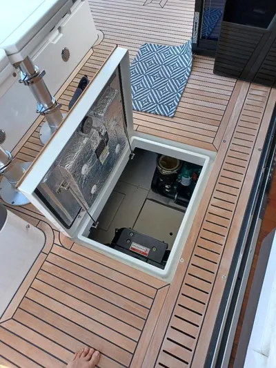 Must Sell, Make An Offer Yacht Photos Pics Galeon 410 HTC 2022 yacht deck with open hatch revealing storage compartment.