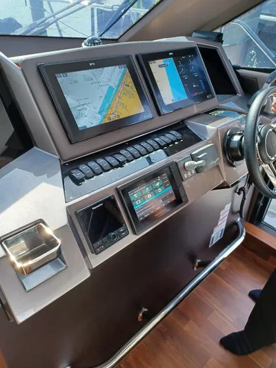 Must Sell, Make An Offer Yacht Photos Pics 2022 Galeon 410 HTC yacht helm with navigation screens and controls.