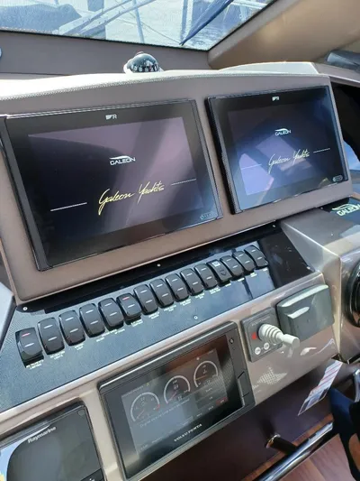 Must Sell, Make An Offer Yacht Photos Pics 2022 Galeon 410 HTC yacht dashboard with dual screens and control panel.