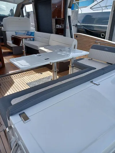 Must Sell, Make An Offer Yacht Photos Pics 2022 Galeon 410 HTC yacht interior with modern seating and dining area.