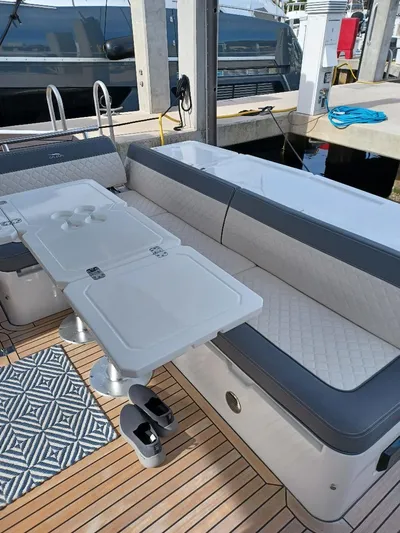 Must Sell, Make An Offer Yacht Photos Pics 2022 Galeon 410 HTC yacht interior with seating, table, and deck details.