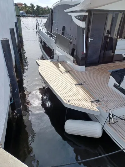 Must Sell, Make An Offer Yacht Photos Pics 2022 Galeon 410 HTC yacht docked, featuring sleek design and spacious deck.