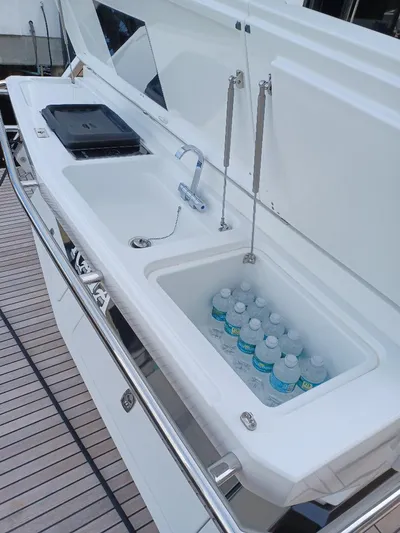 Must Sell, Make An Offer Yacht Photos Pics Outdoor kitchenette on 2022 Galeon 410 HTC yacht with sink and cooler.